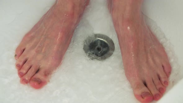 Man Has a Shower - Closeup of Feet
