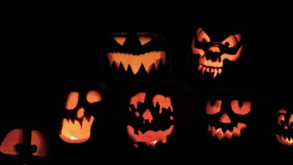 Glowing in the dark spooky Jack-o-lanterns carved from real pumpkins.