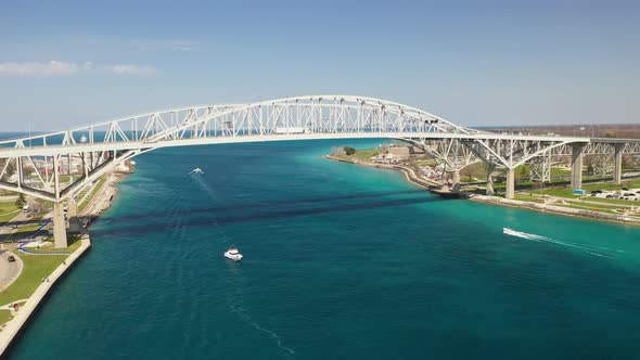 Blue Water Bridge connecting Port Huron, Michigan USA and Sarnia, Ontario Canada with droneing forwa
