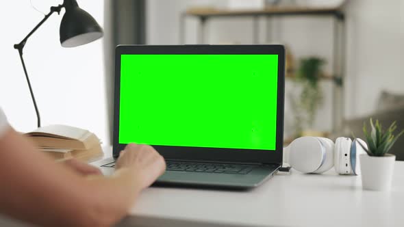 Laptop with Green Screen at Home