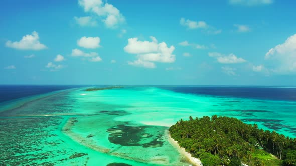 Luxury fly over copy space shot of a paradise sunny white sand beach and aqua blue water background 