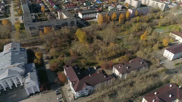 Aerial view of park next to house of culture and three-story and five-story houses 56