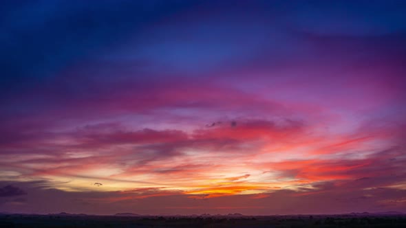 View of Colorful dramatic sky sunset or sunrise with Moving clouds background