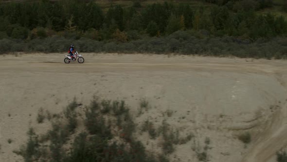 Enduro Motorcycle Rides Offroad on the Sands