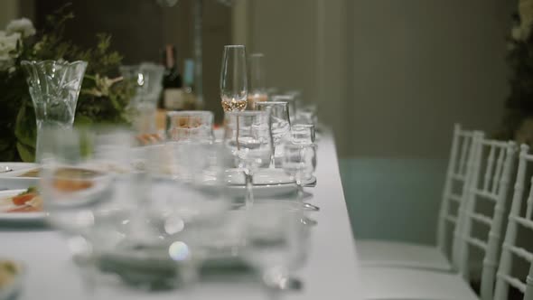 Decorated Table for Newlyweds at a Wedding Celebration, Glasses of Champagne on the Table. Close Up