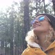 portrait of beautiful woman looking and enjoying nature in a forest with some trees - traveling - VideoHive Item for Sale