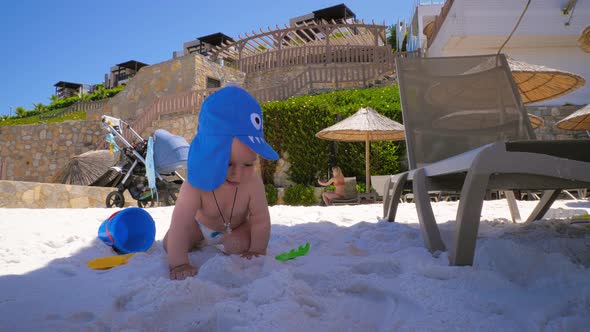 Emotions of a Little Happy Boy Who Is on the Beach for the First Time with Mom