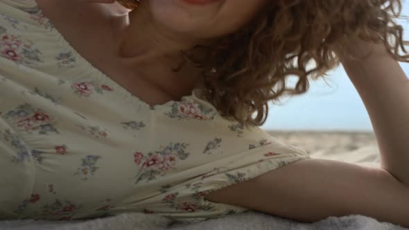 Beautiful Woman Covering Face with Straw Hat Hiding From Summer Sunlight Closeup