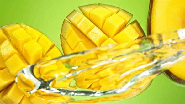 Super Slow Motion Shot of Water Splash Falling on Fresh Mango at 1000Fps