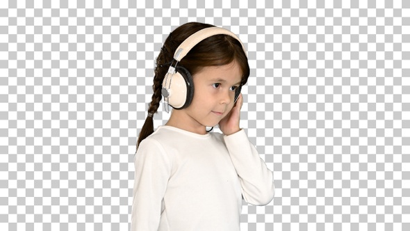 Cute girl dressed in white holding headphones, Alpha Channel