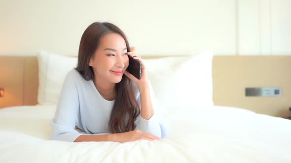 Young asian woman use smart phone