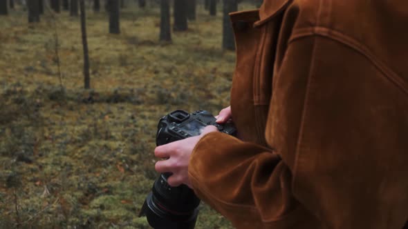 The Photographer is Reviewing His Footage