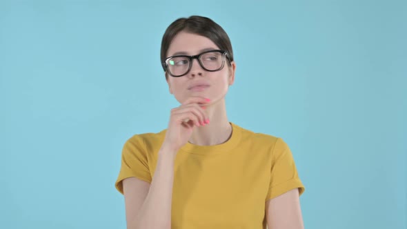 Young Woman Thinking and Getting Ideas on Purple Background