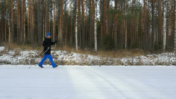 Man Walks Outdoors On Winter Road, Does Sport, And Exercising Outdoors.