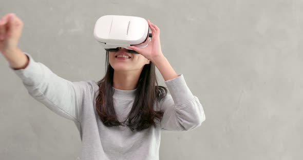 Woman Playing Game with Vr Device