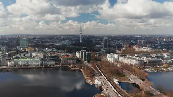 Aerial View of Traffic Across Binnenalster Lake with Hamburg Panorama and TV Tower in the Background