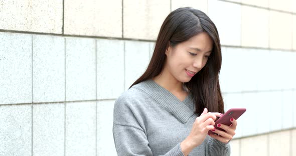 Woman use of mobile phone at outdoor