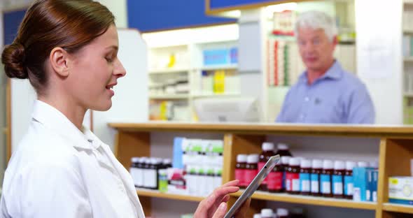 Pharmacist using digital tablet