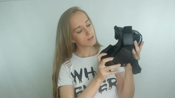 Young Girl Uses a Virtual Reality Helmet