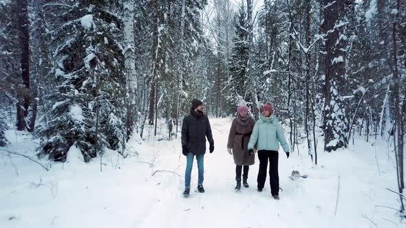 Friends Enjoy Winter Holidays Walking Along Park