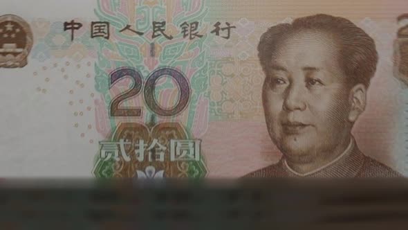 20 Chinese Yuan banknotes in cash machine.
