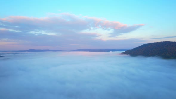 4K Sun is rising above sea of clouds until the horizon