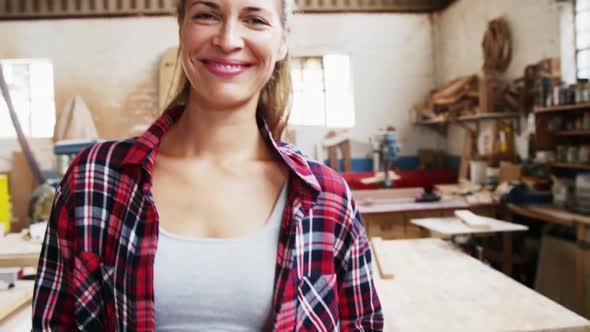 Portrait of attractive carpenter smiling for camera
