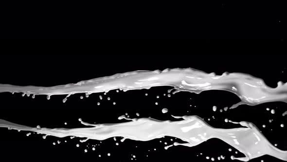 Super Slow Motion Shot of Twisting White Splash at 1000Fps Isolated on Black Background