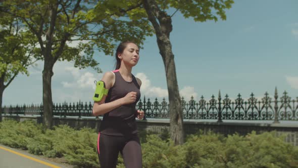 Fitness Asian Woman Running Park Lane in Morning