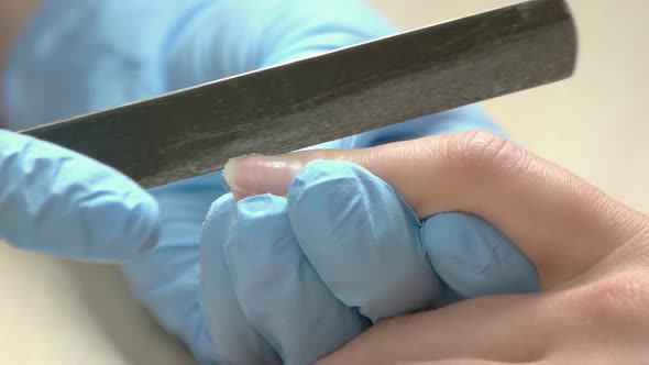 Manicurist Filing Nails, Slow Motion.