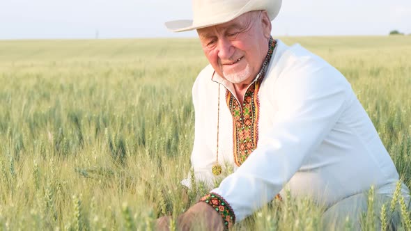 A Ukrainian Peasant in an Embroidered Jacket Touches Wheat