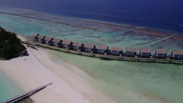 Aerial drone seascape of coastline beach by blue sea with sand background