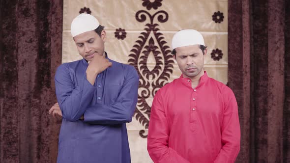 Two Muslim men thinking