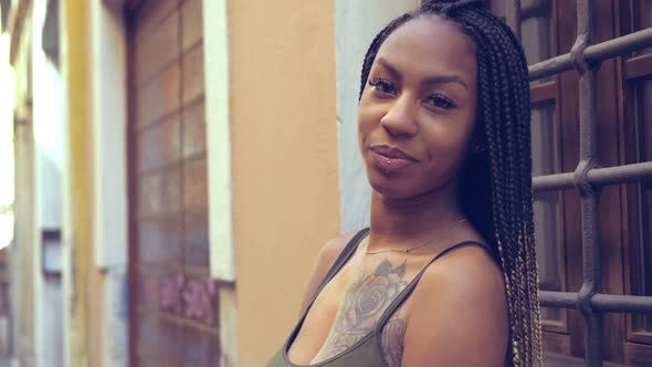 south american woman in the street stares at the camera with provocative look