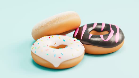 Three donuts on blue background. Chocolate with glazing and colorful sprinkles.