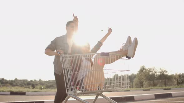 Young Friends Having Fun on Shopping Trolleys