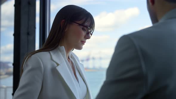 Upset Worker Meeting Boss at Window Closeup