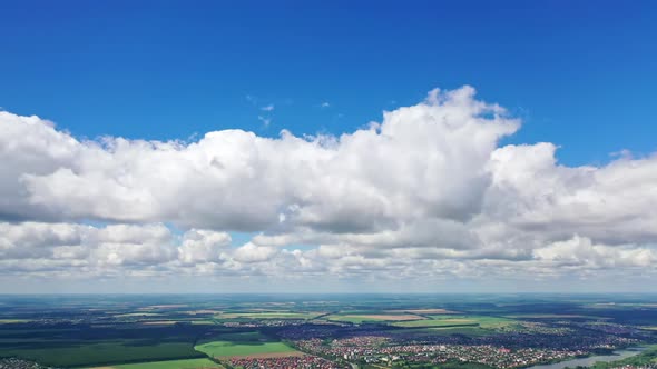 Clouds landscape over city. Part of city view above the clouds from drone