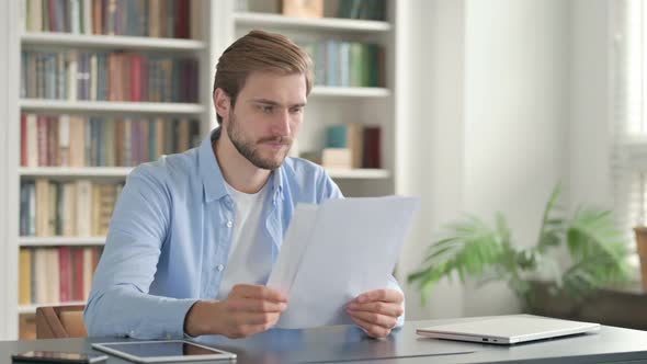 Successful Man Reading Documents