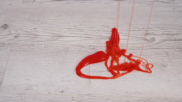 Red Slime Drips Onto the Wooden Floor