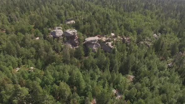 Stone Town. Huge stones in the forest. Aerial. Russia, Perm region 04