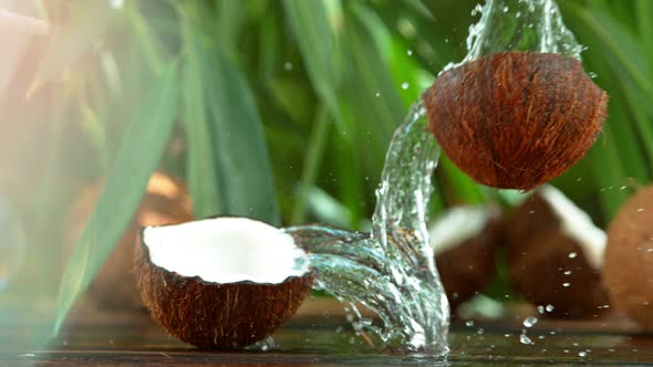 Super Slow Motion Shot of Water Splashing From Coconut at