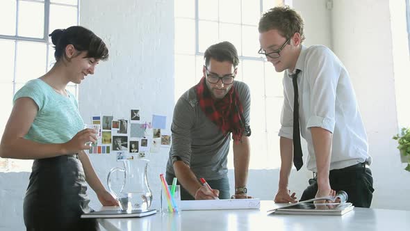 Young fashion designers working in studio