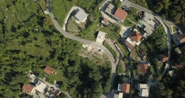 Aerial birds eye view of buildings, built on the hillside in Risan, Montenegro.