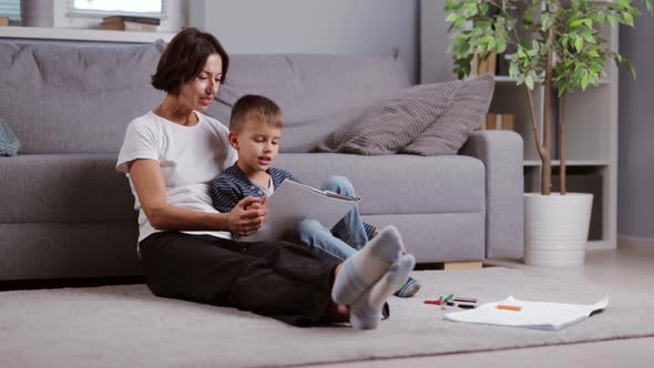 Mother and Son Reading Book