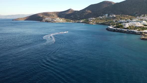 Aerial View of a Motor Boat Towing a Water Skier. Elounda, Crete, Greece