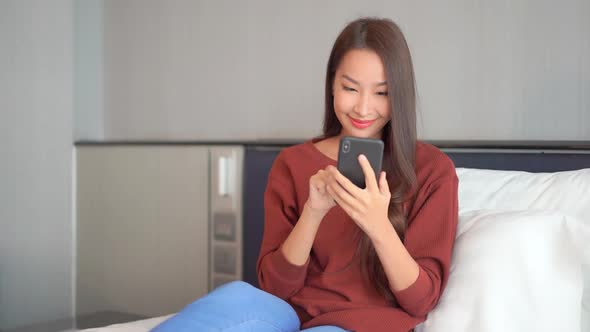 Young asian woman use smart phone