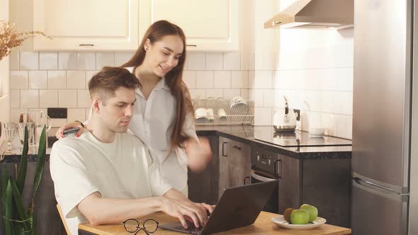 Man Work at Home, He Is in Freelance During Quarantine Coronavirus, He Use Laptop.