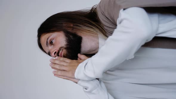 Jesus Prays with His Hands Together on a White Background