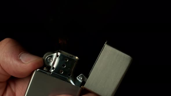 Super Slow Motion Shot of Igniting Metallic Lighter at 1000Fps alt